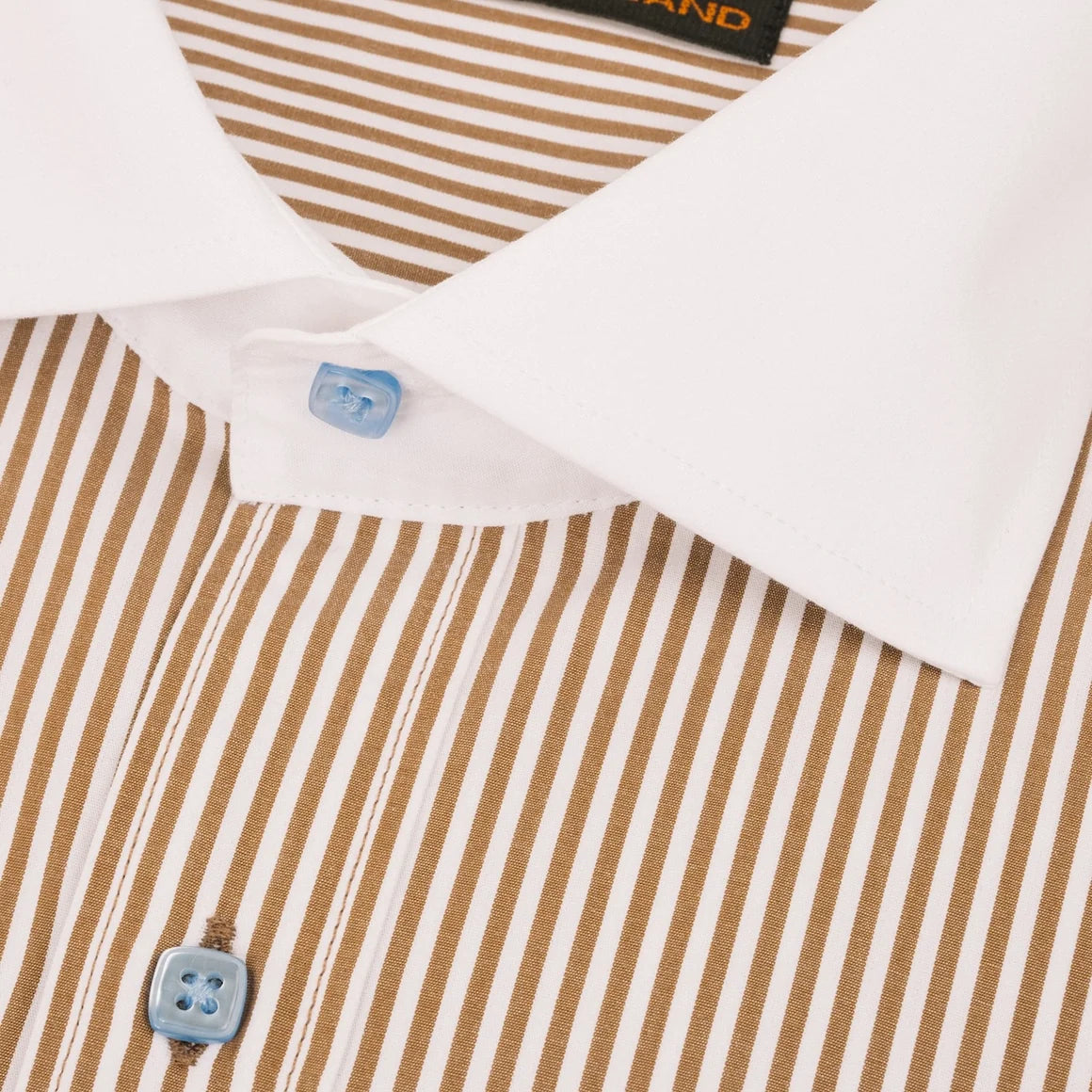 Close-up of a collared dress shirt with brown and white vertical stripes, a white pointed collar, and light blue buttons.