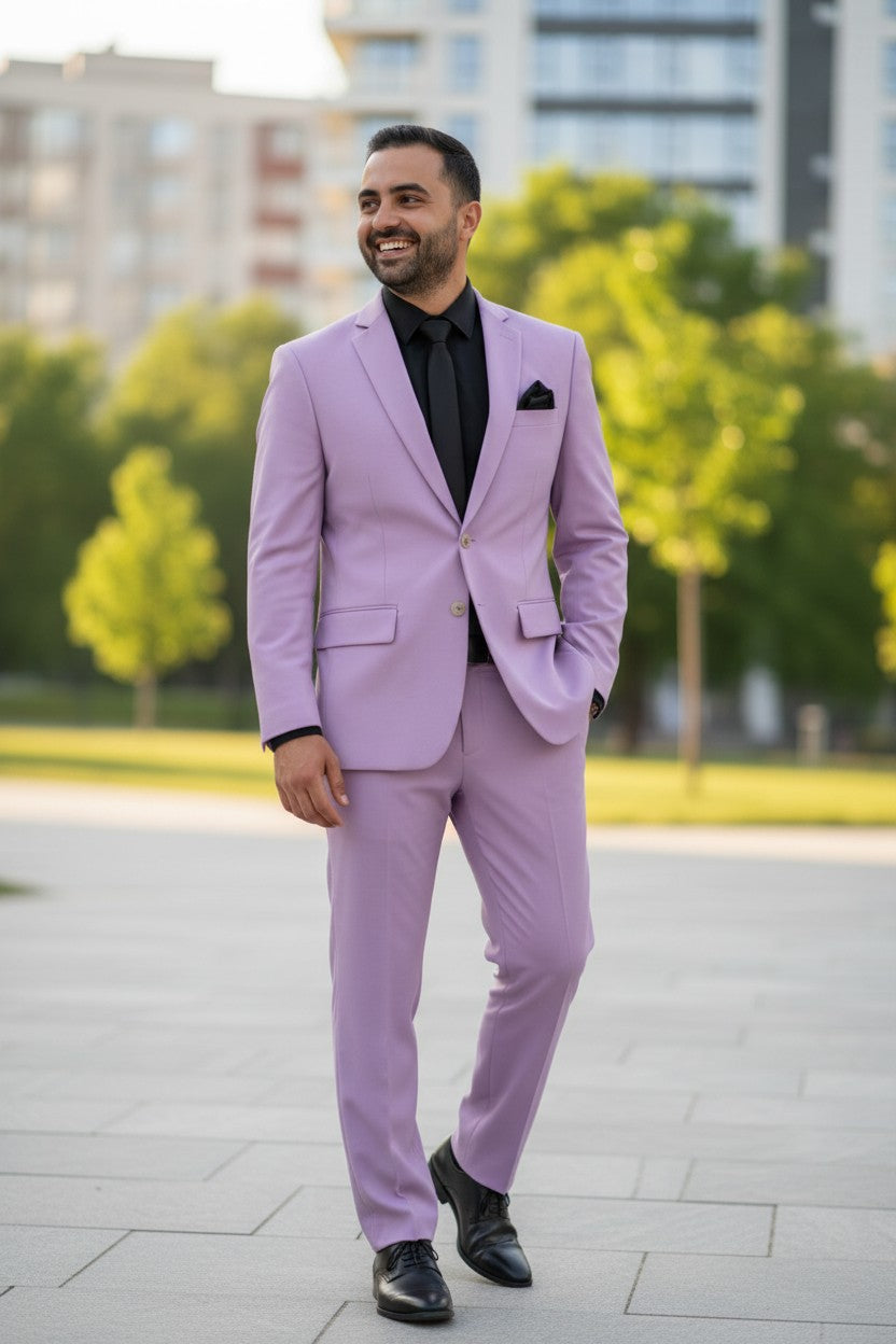 Man wearing a light purple suit with black shoes and shirt in an urban setting