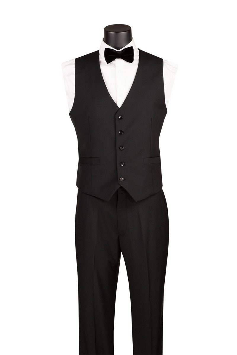 A black formal tuxedo vest and matching trousers displayed on a mannequin torso with a white dress shirt, black bow tie, and black vest. The mannequin is centered against a plain white background.