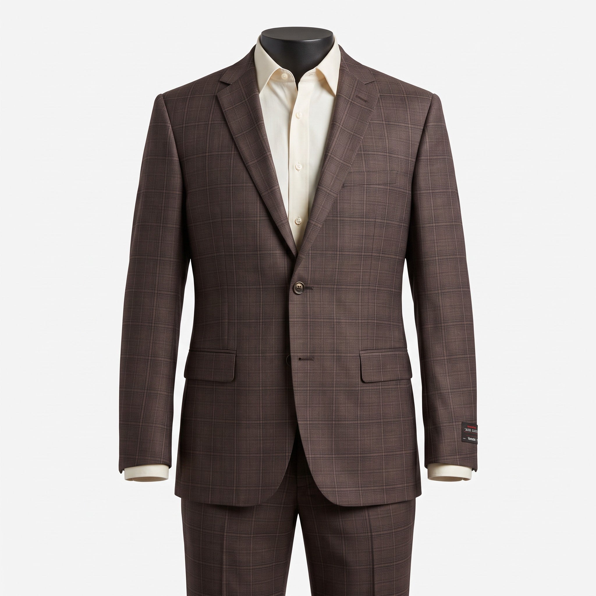 A brown windowpane plaid suit jacket and matching trousers displayed on a mannequin torso, styled with a cream dress shirt against a light gray background.