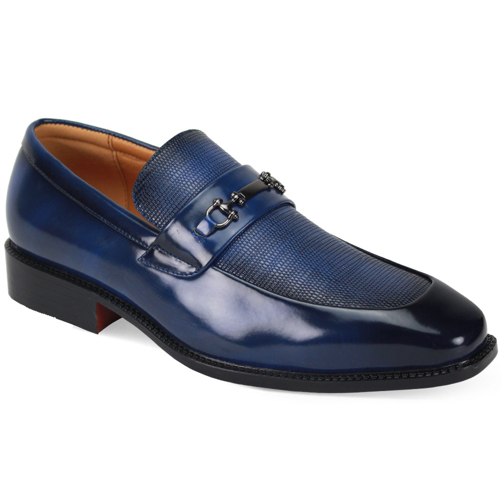 A men's navy blue leather loafer with a glossy patent finish on the toe cap, a textured grain panel across the vamp, and a decorative dark metal bit detail, shown against a plain white background.