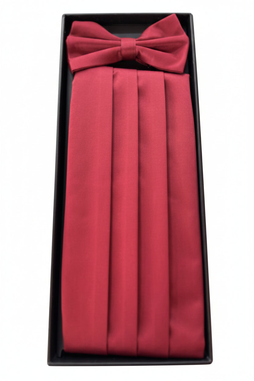 A Burgandy pleated formal cummerbund set with a matching bow tie, presented in a black gift box against a white background.