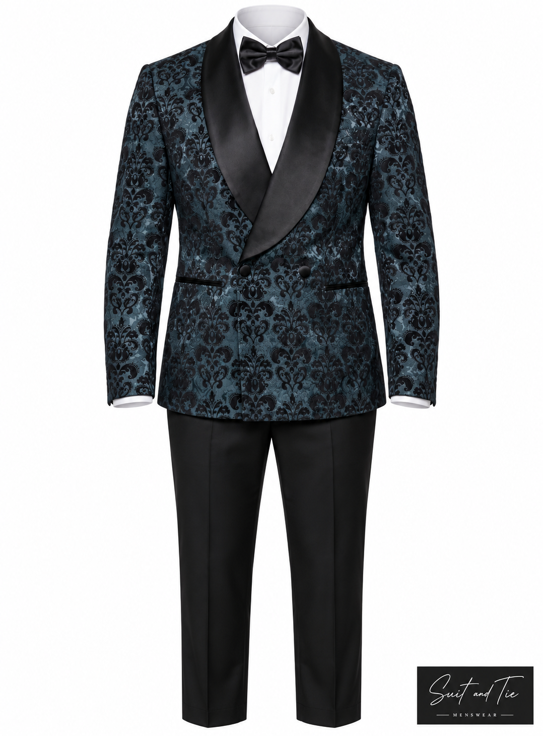 A men's formal tuxedo jacket and trousers set displayed on a white mannequin torso. The jacket features a black and teal damask patterned fabric body with contrasting black satin shawl lapels, paired with black trousers, a white dress shirt, and a black bow tie.