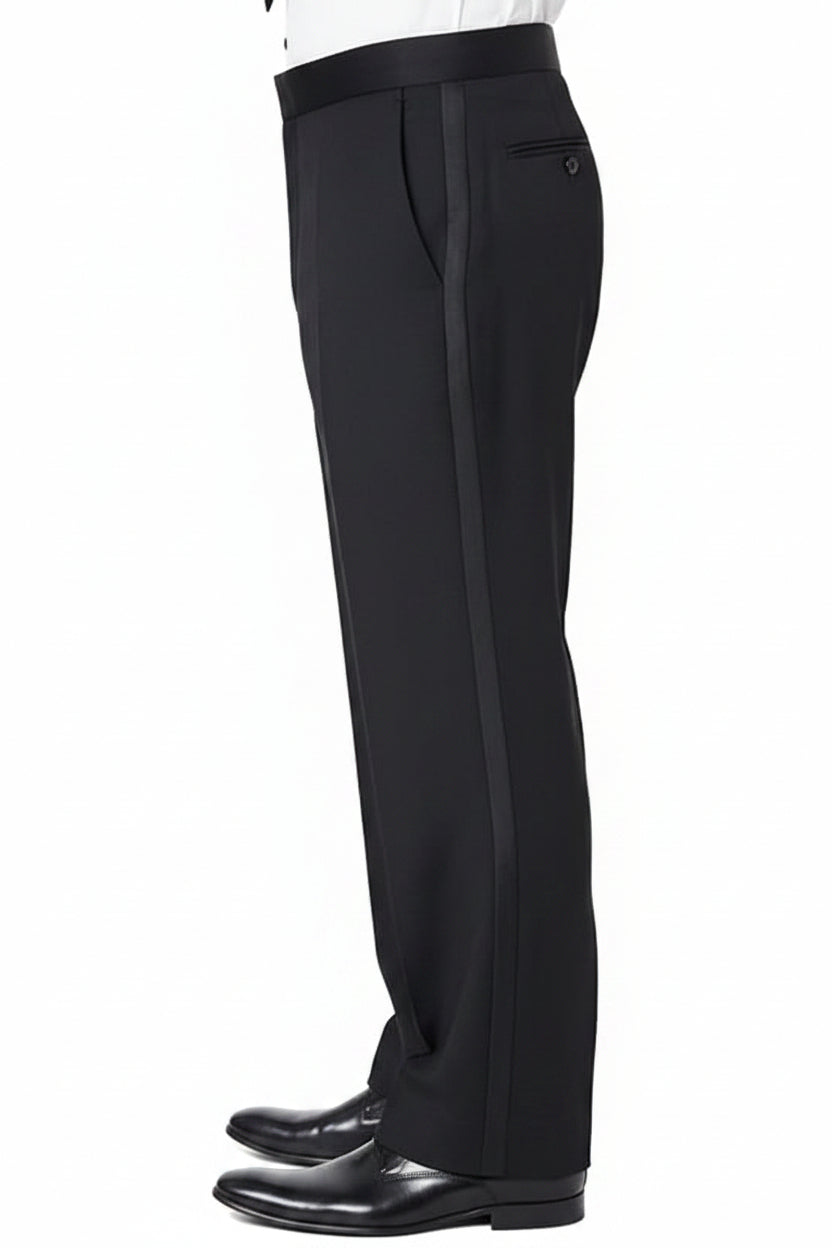 A man wearing black formal trousers with a black waistband, paired with a white dress shirt and black dress shoes, shown from the waist down against a white background.