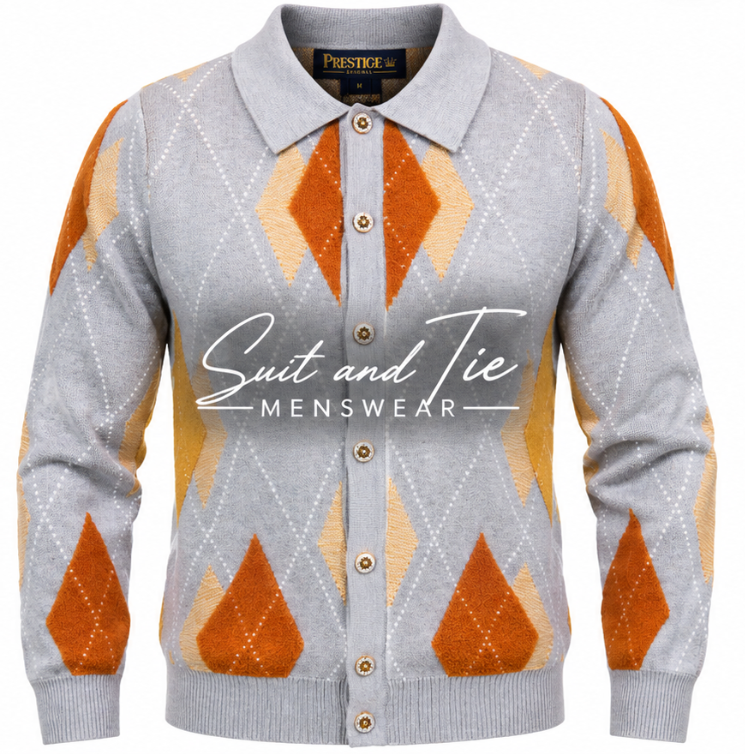 A gray knit cardigan sweater with an orange and beige argyle pattern, featuring a button-down front, a pointed collar, and a visible 'Prestige' neck label. A large 'Suit and Tie Menswear' watermark is overlaid across the center.