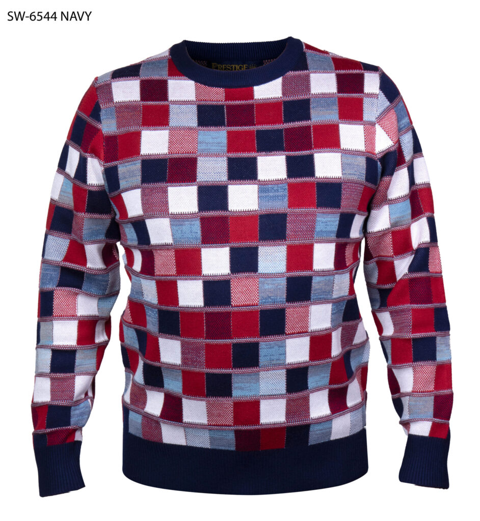 A long-sleeve crewneck sweater featuring a colorful checkered pattern of red, navy, white, and light blue squares, with solid navy ribbed cuffs, collar, and hem.