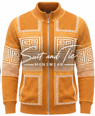 A men's zip-up sweater in a warm mustard yellow-orange color, featuring white geometric Greek key patterns on the chest, sleeves, and hem. The sweater has a ribbed mock neck, cuffs, and hem, and is shown against a plain white background with a 'Suit and Tie MENSWEAR' watermark overlay.