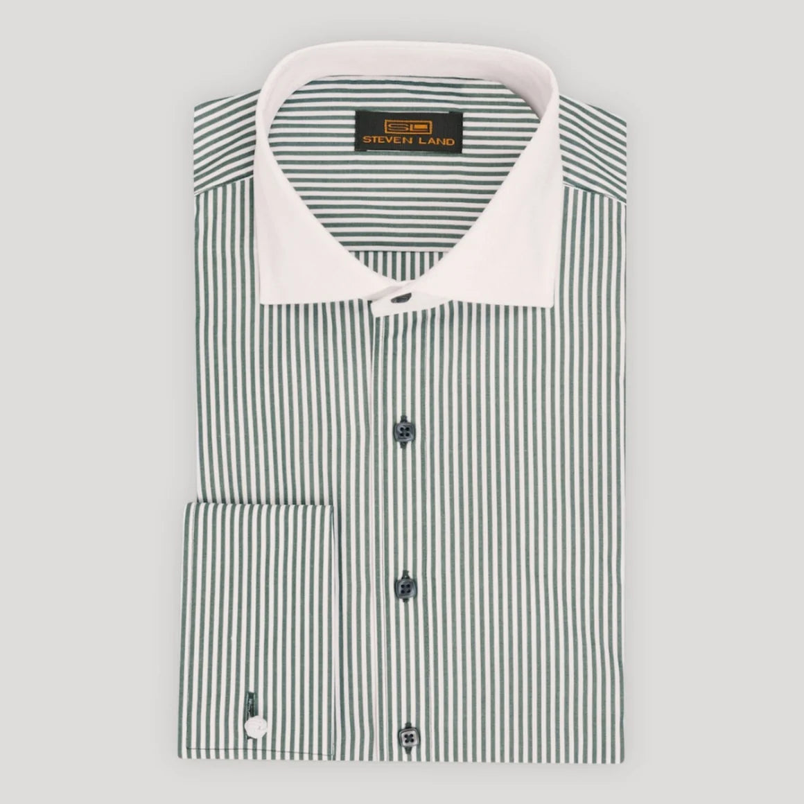 A folded long-sleeve dress shirt by Steve Laird, featuring a white collar and fine vertical stripes in green and white. The shirt is neatly folded on a light gray background.